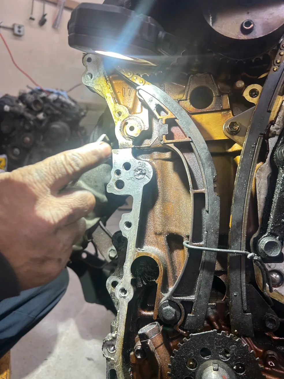 Internal engine timing components under inspection
